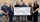 A group of six adults stands indoors holding an oversized ceremonial check. The check shows the ExxonMobil logo and is made out to the Texas State Aquarium for $250,000, dated December 2025, with Gulf Coast Growth Ventures mentioned as well.