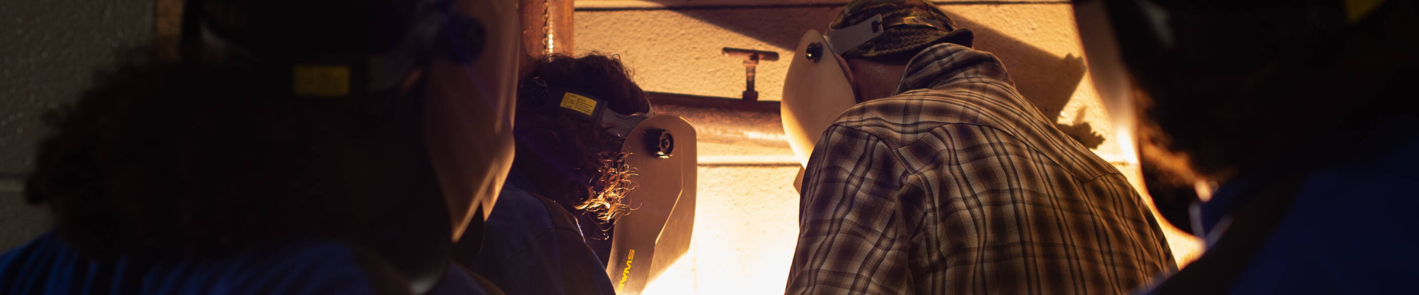 Girls learning to weld at GCGV's girls summer leadership camp