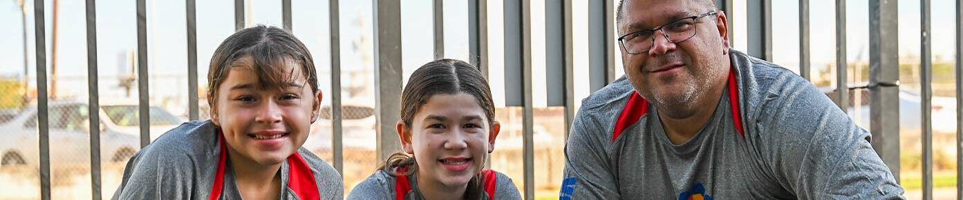 Ricardo and two girls at united way action day